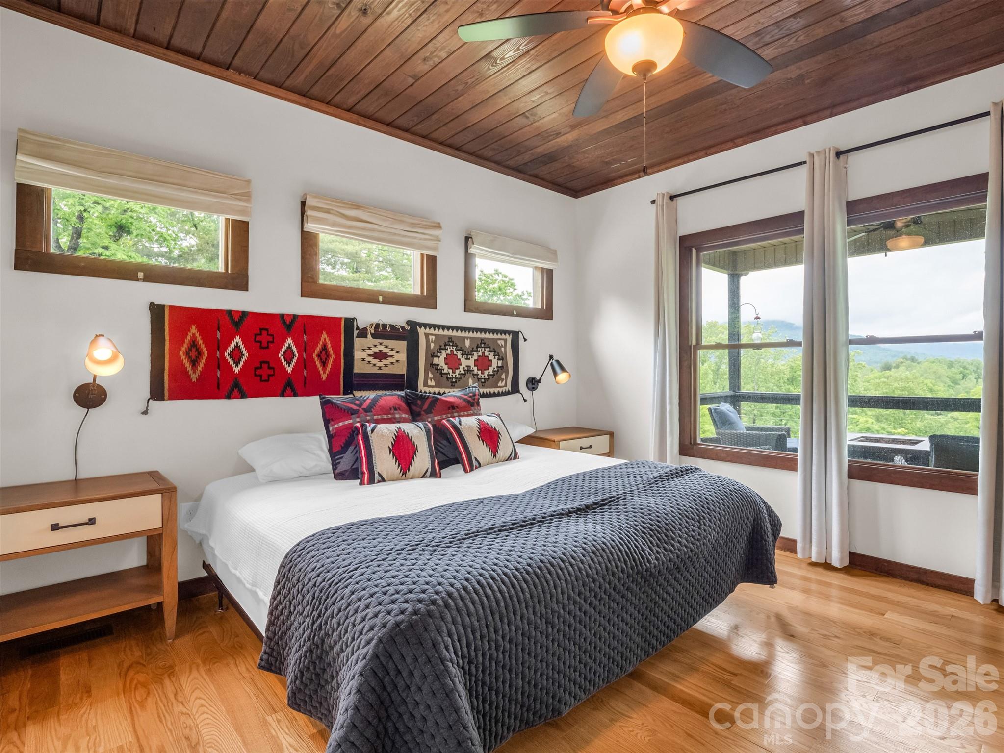 139 Picnic Point Road Lake Lure, NC 28746 - Photo 17 of 41 a bedroom with a bed and a night stand