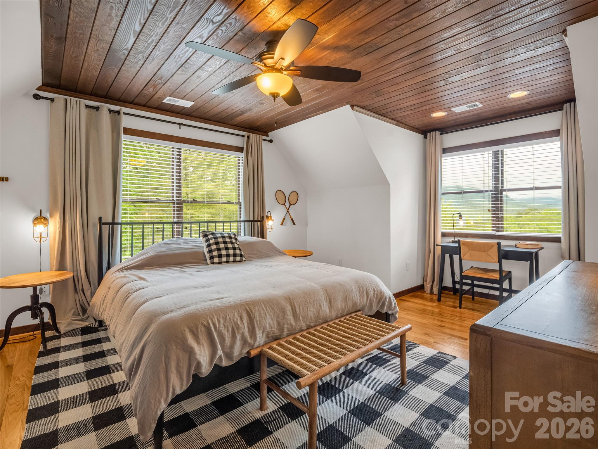 139 Picnic Point Road Lake Lure, NC 28746 - Photo 20 of 41 a bedroom with a bed and a table
