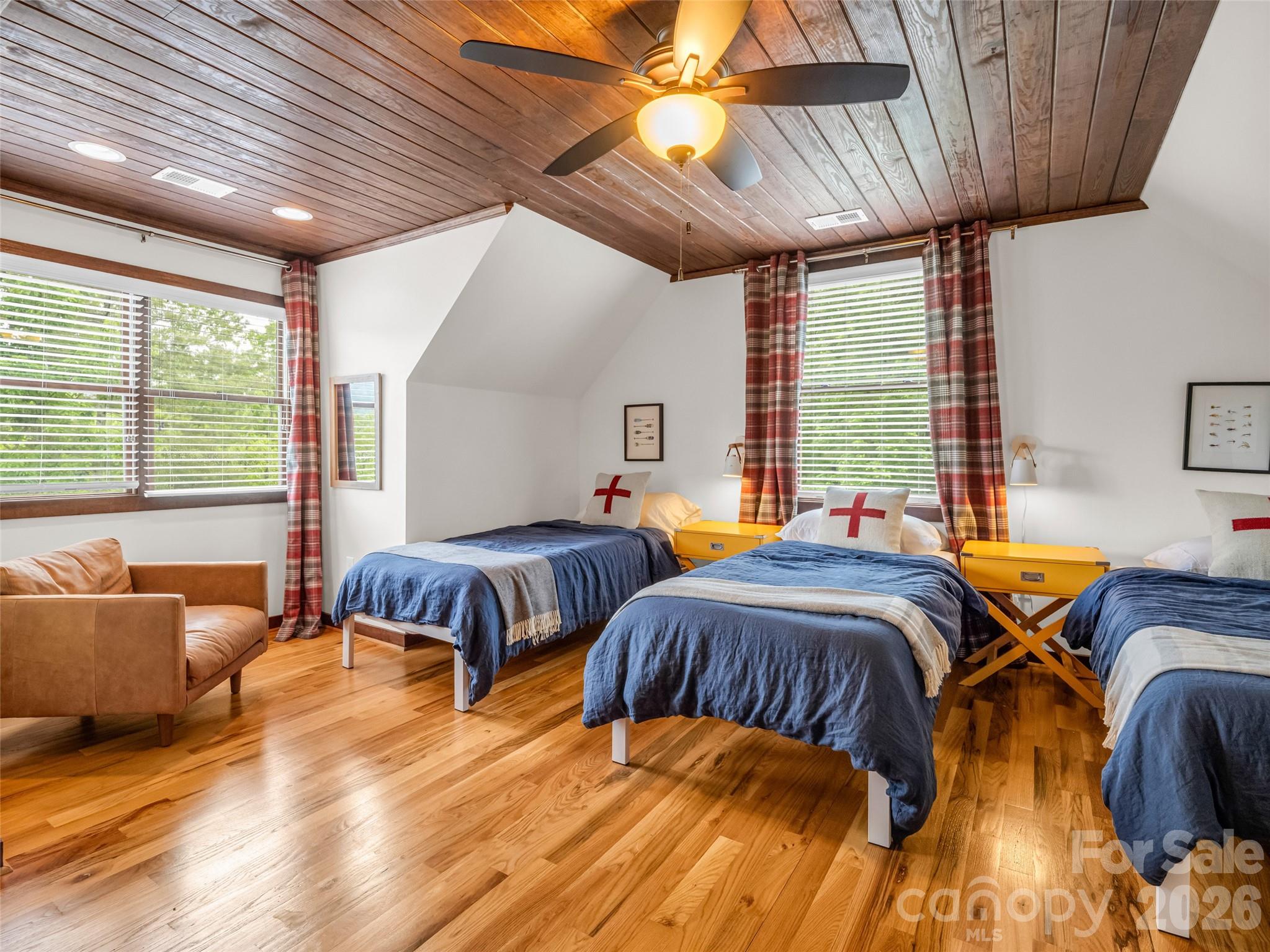 139 Picnic Point Road Lake Lure, NC 28746 - Photo 23 of 41 a bedroom with furniture and a large window