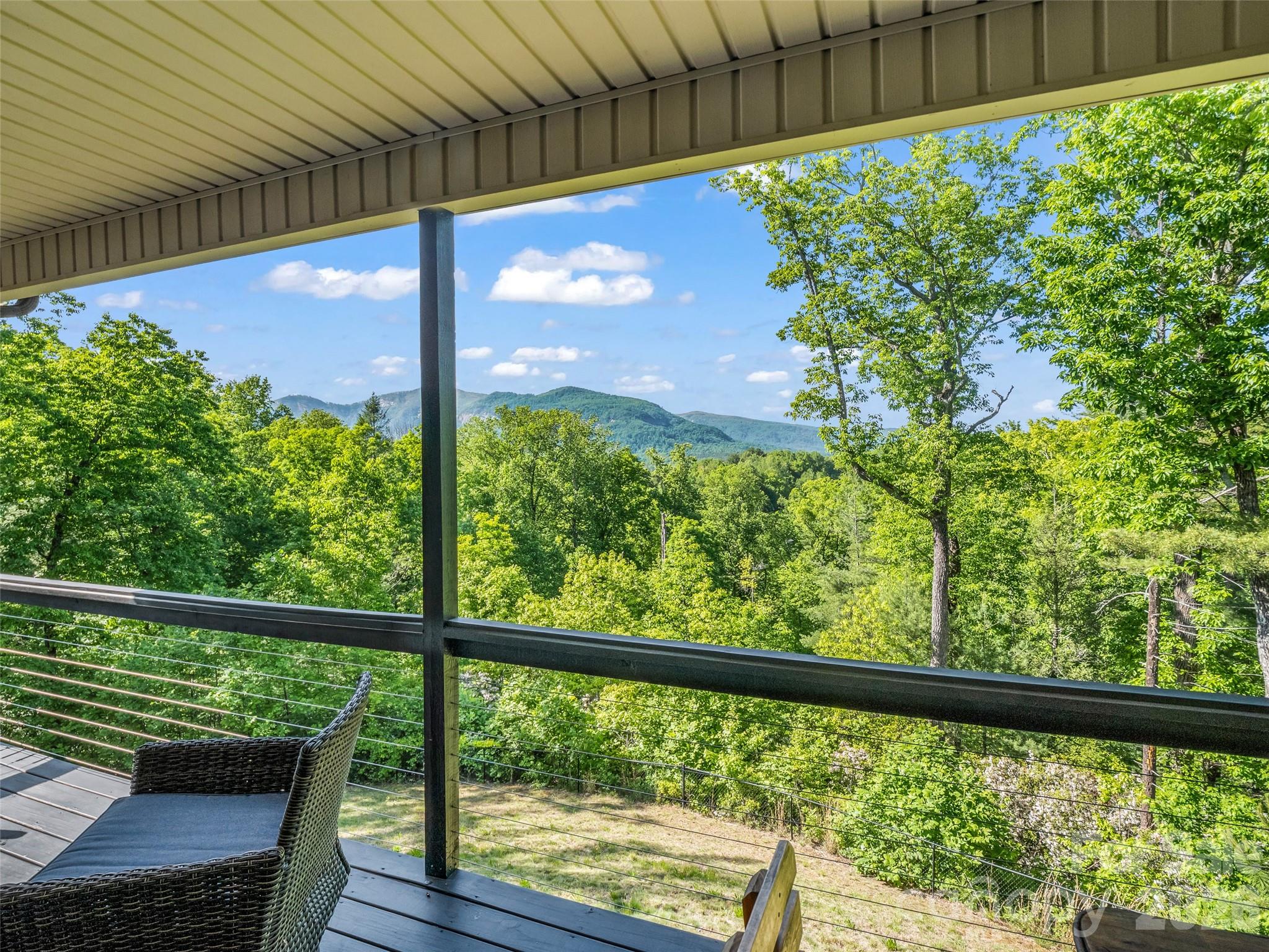139 Picnic Point Road Lake Lure, NC 28746 - Photo 26 of 41 a view of a back yard from a balcony