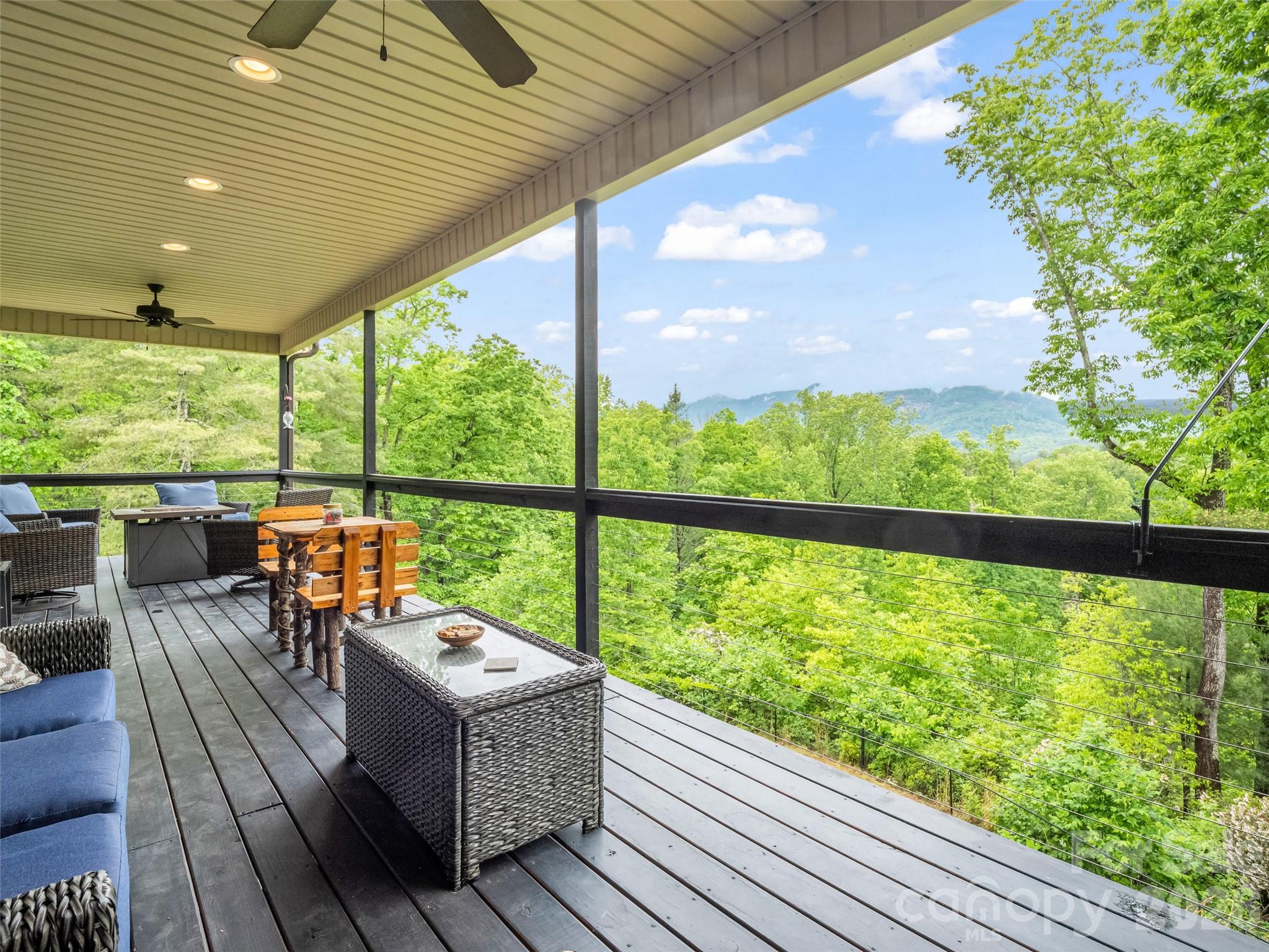 139 Picnic Point Road Lake Lure, NC 28746 - Photo 27 of 41 a balcony with furniture and city view