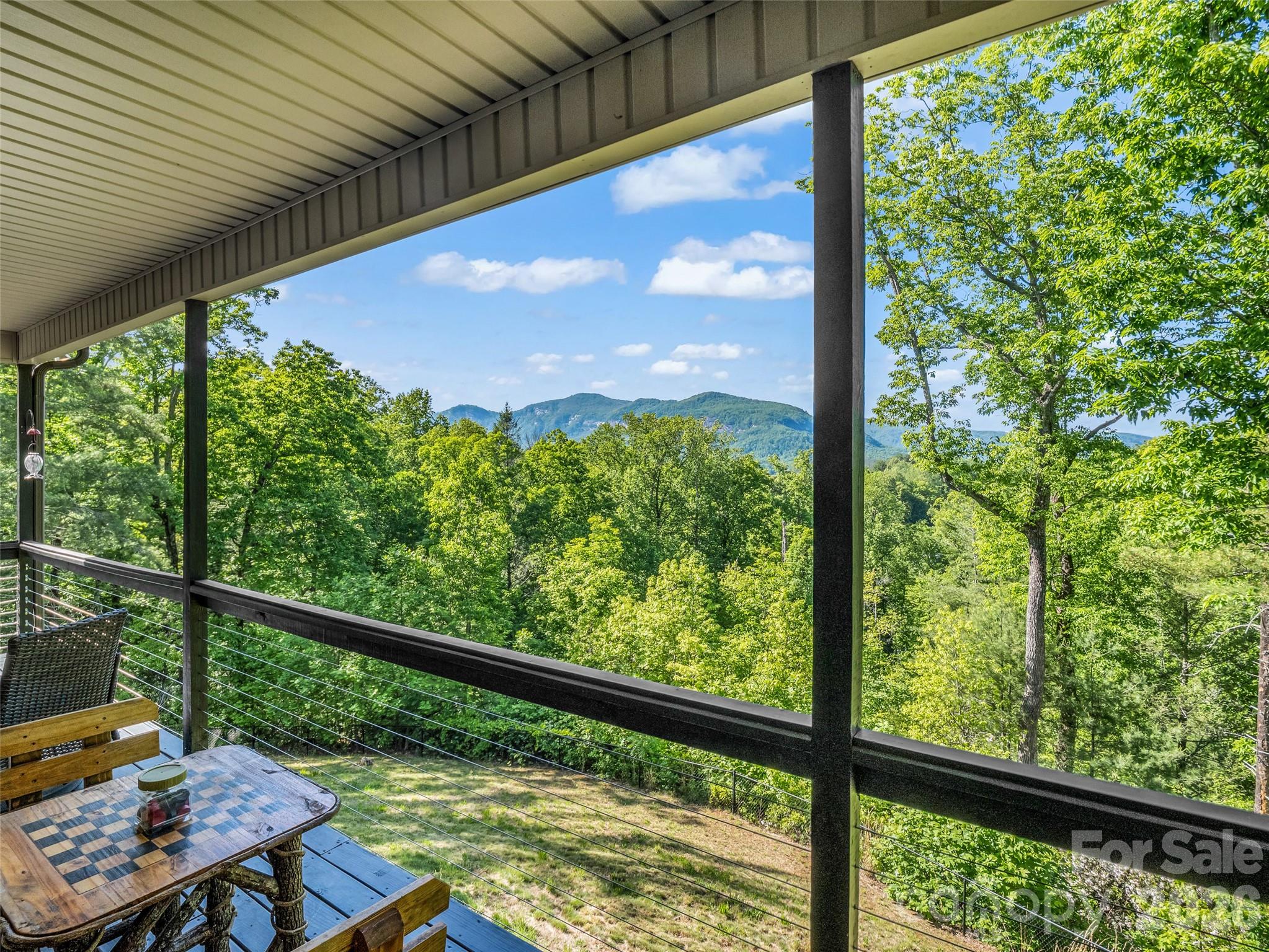 139 Picnic Point Road Lake Lure, NC 28746 - Photo 28 of 41 a view of a balcony with wooden floor