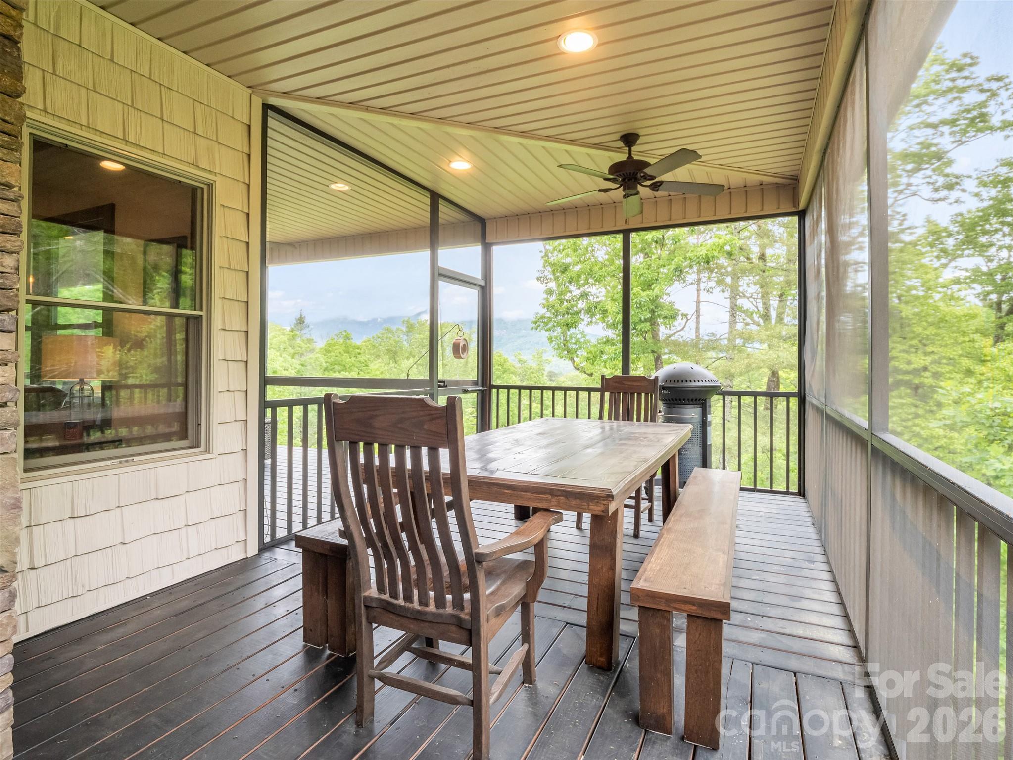 139 Picnic Point Road Lake Lure, NC 28746 - Photo 29 of 41 a view of a patio with a table and chairs