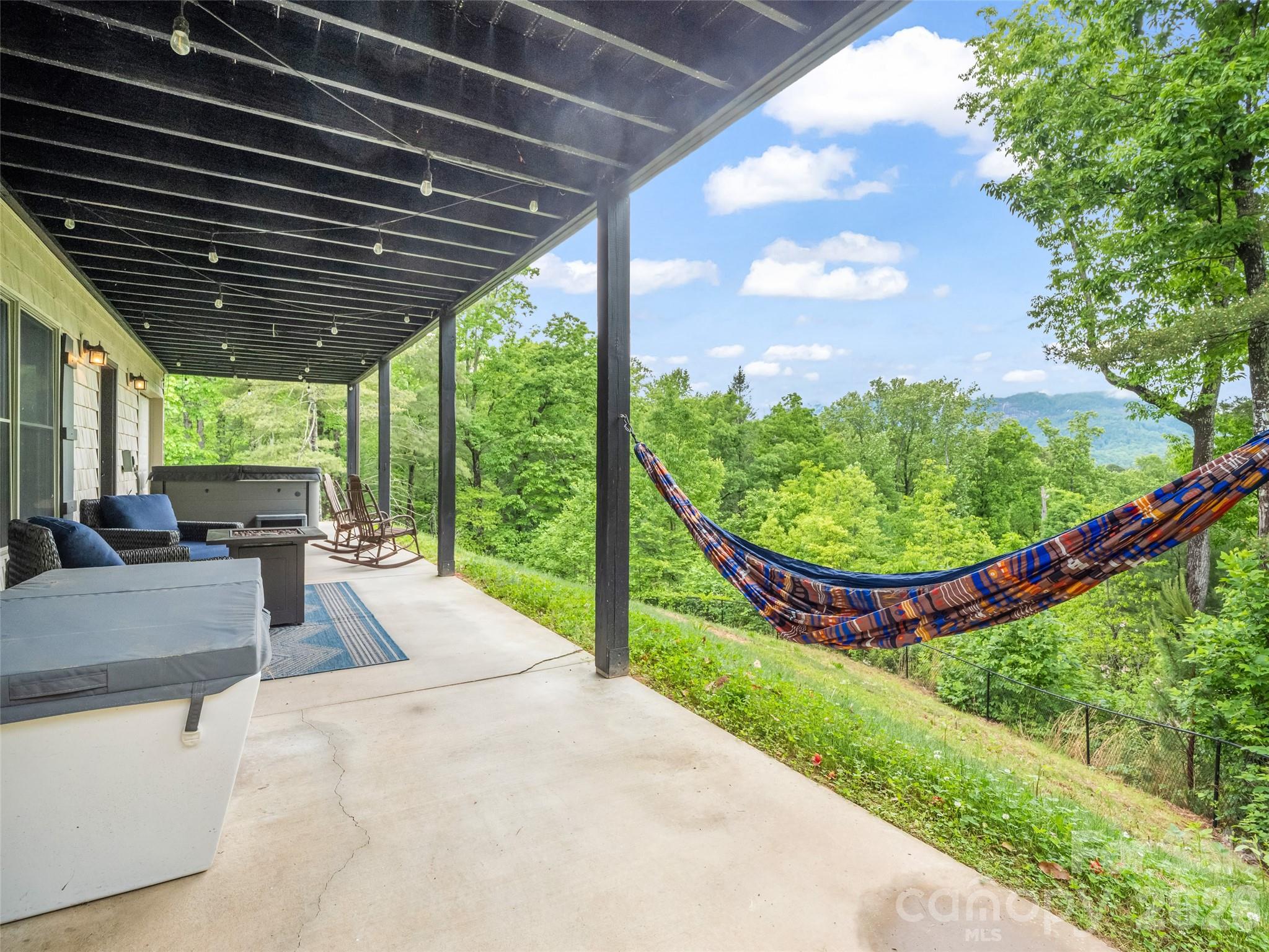139 Picnic Point Road Lake Lure, NC 28746 - Photo 30 of 41 a view of a backyard with a tub and couches