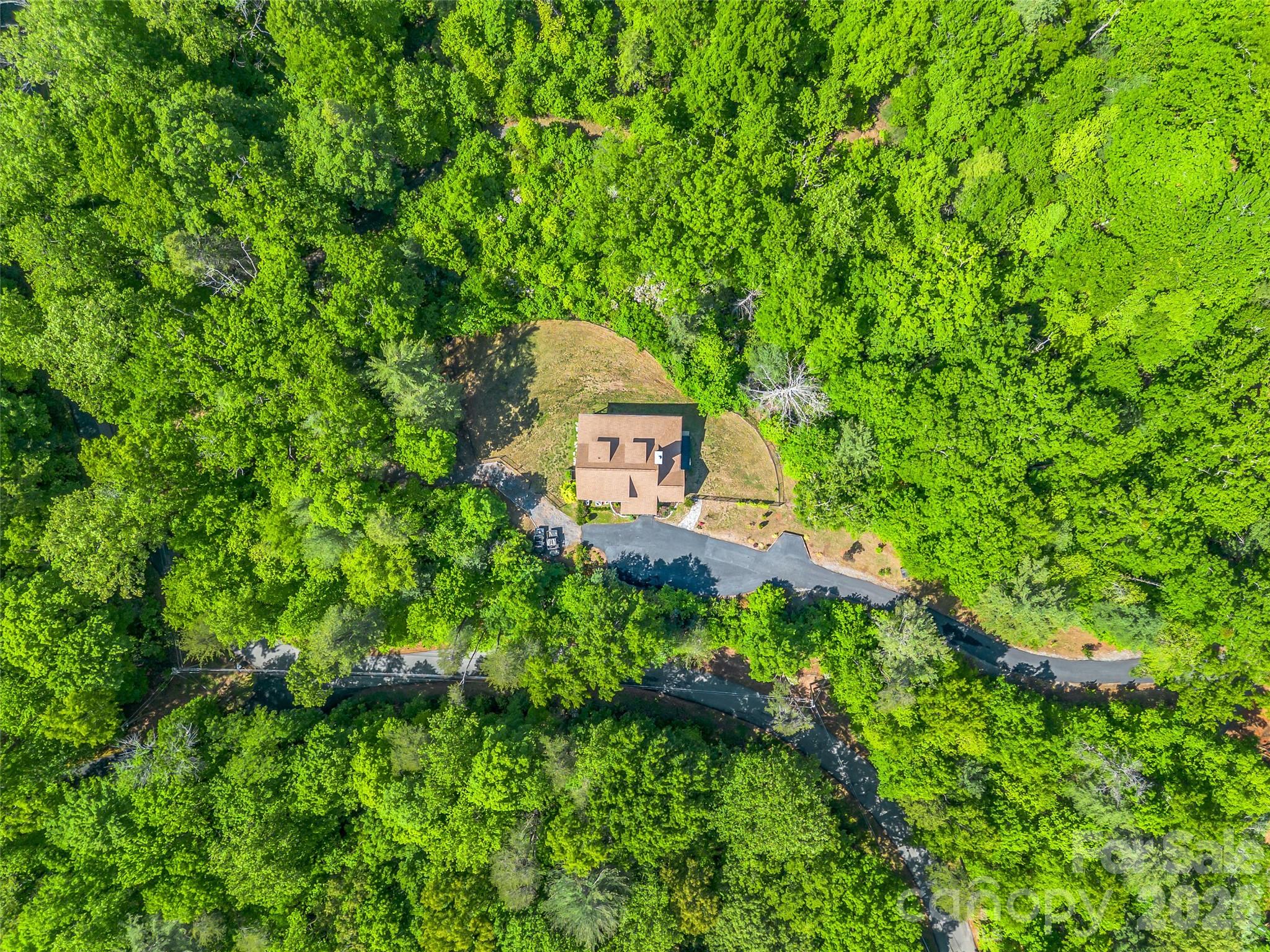 139 Picnic Point Road Lake Lure, NC 28746 - Photo 34 of 41 a aerial view of a house with a yard