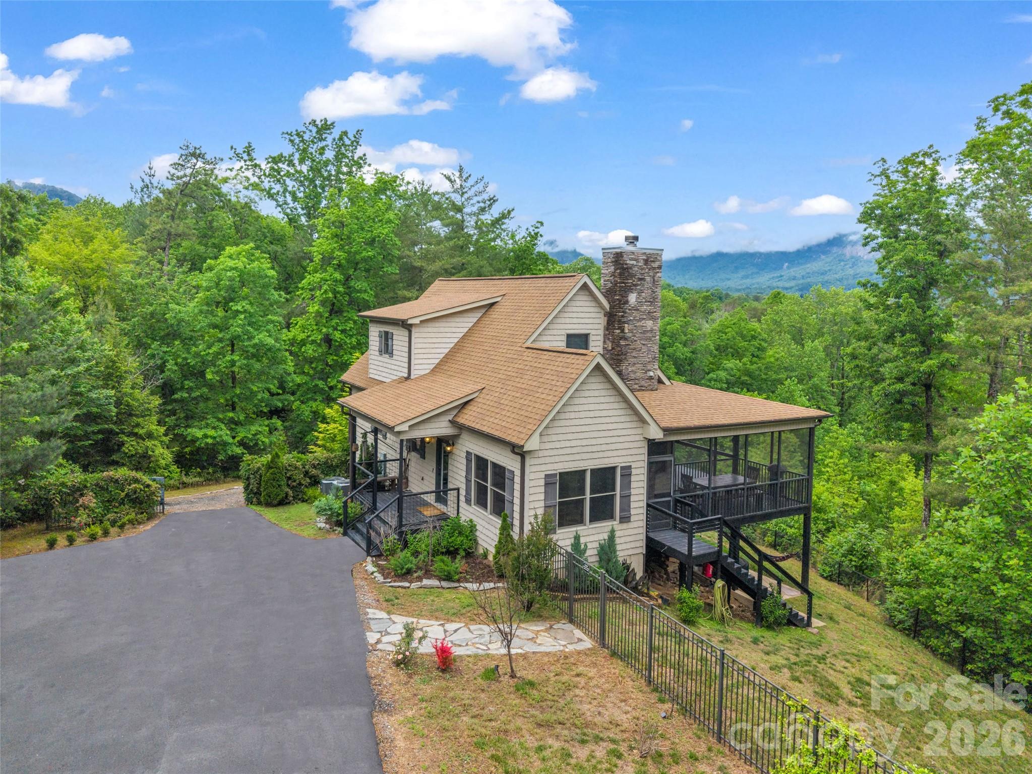 139 Picnic Point Road Lake Lure, NC 28746 - Photo 5 of 41 a aerial view of a house with swimming pool and sitting area