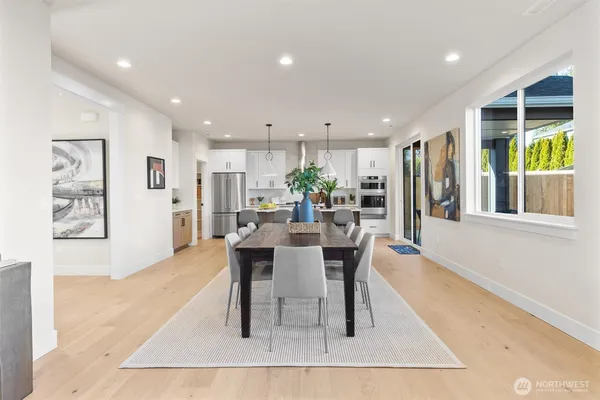 a view of a dining room with furniture window and outside view
