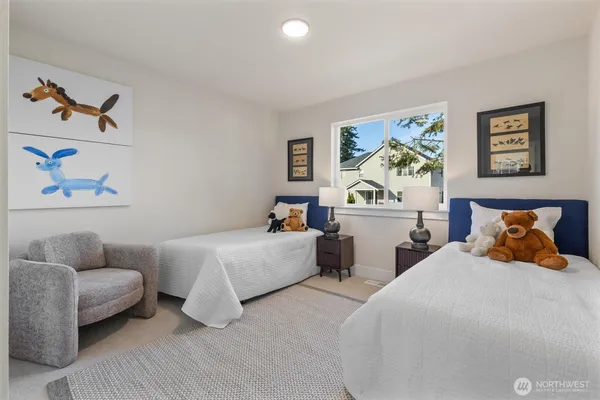a bedroom with bed and a couch