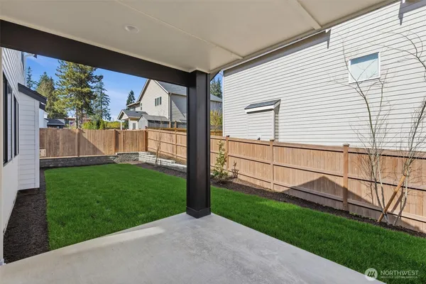 a view of a back yard of the house