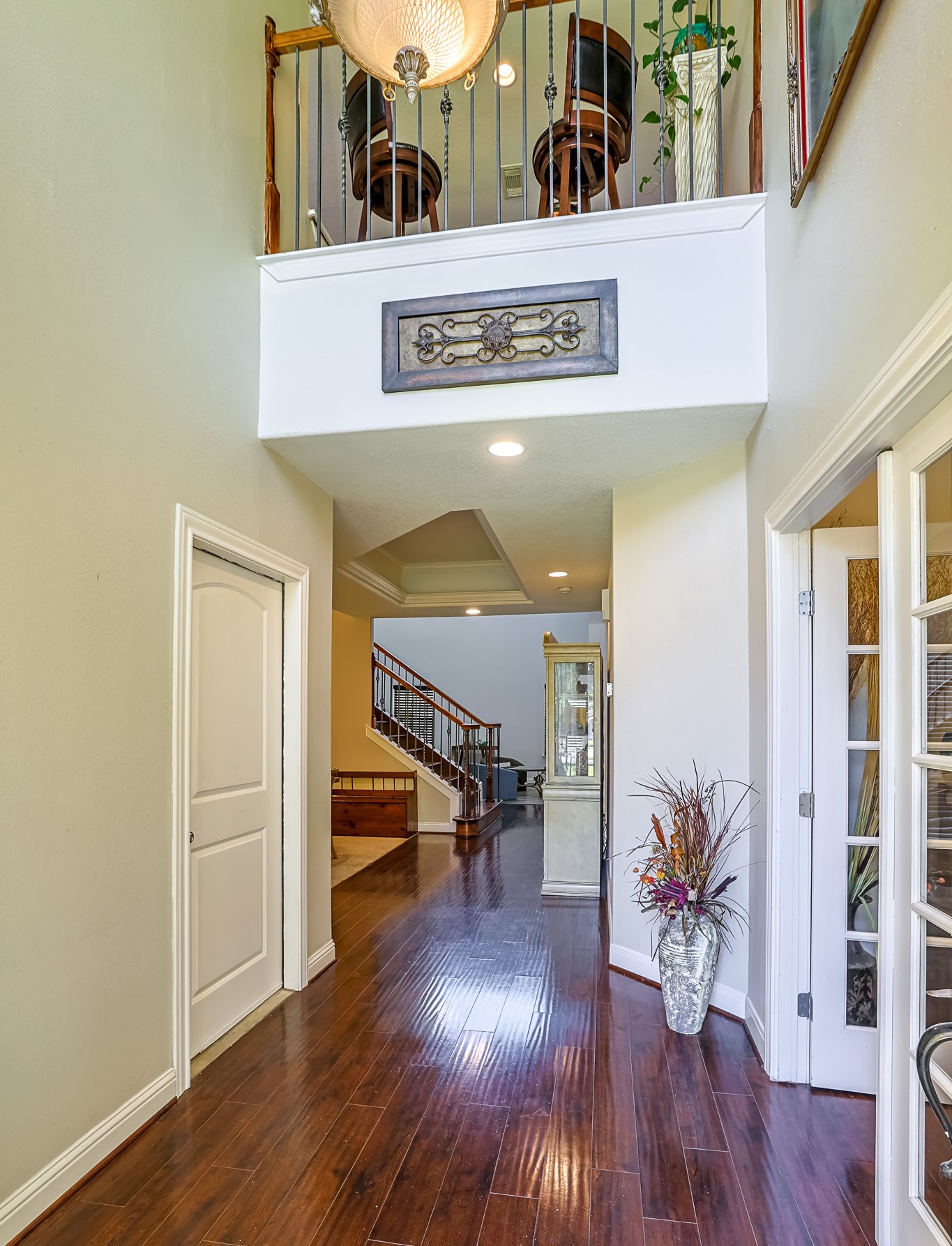 30119 West Geneva Drive Spring, TX 77386 - Photo 4 of 35 Elegant hardwood floors guide you into the heart of the home, accented by wrought-iron details and timeless trim work.