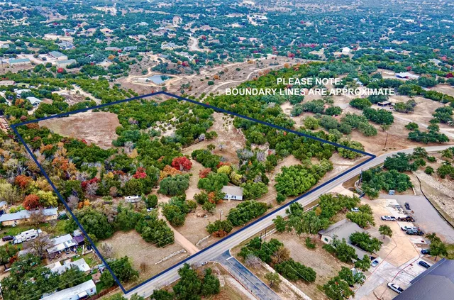 an aerial view of a city and mountain view in the background