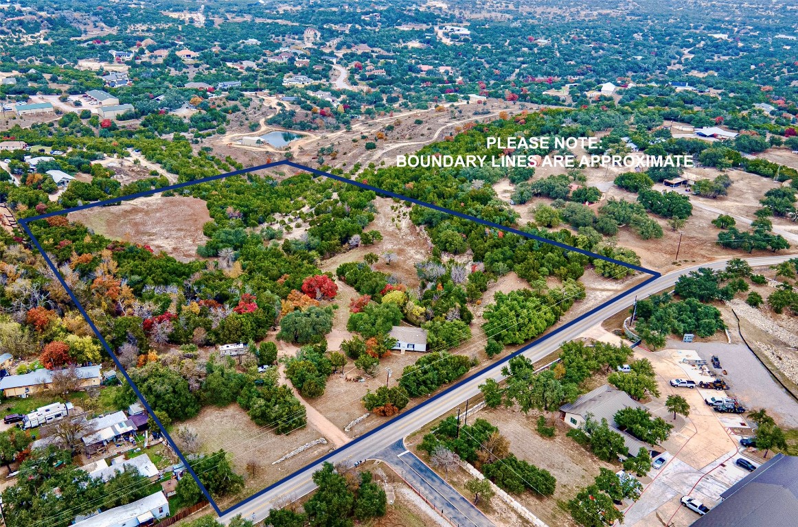 an aerial view of a city and mountain view in the background