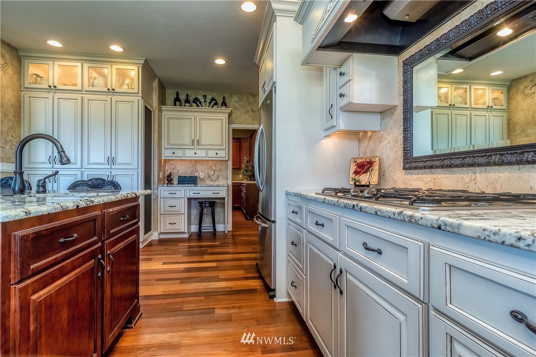 3745 Pranger Road Walla Walla, WA 99362 - Photo 14 of 40 a kitchen with stainless steel appliances granite countertop a sink and a stove