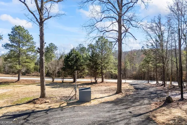 a view of balcony with wooden floor and fence