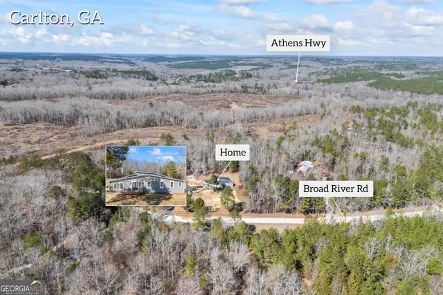 a kitchen with granite countertop stainless steel appliances a sink stove top oven and refrigerator