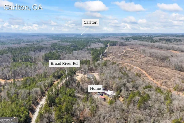 a kitchen with granite countertop white cabinets stainless steel appliances and a sink