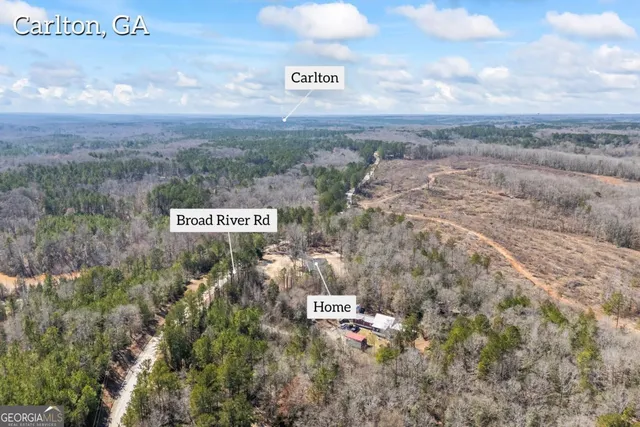 a kitchen with granite countertop white cabinets stainless steel appliances and a sink