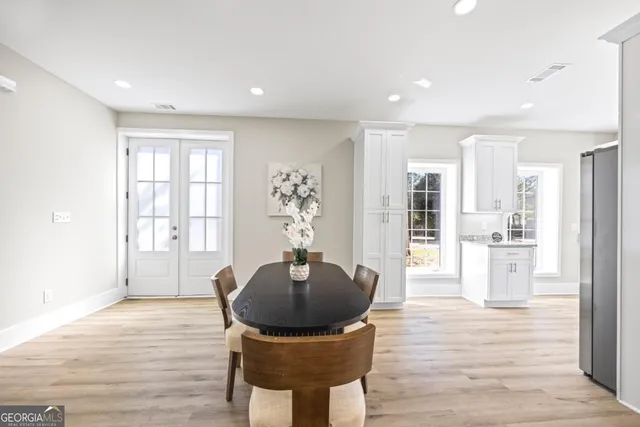 a view of a livingroom with a furniture wooden floor and window