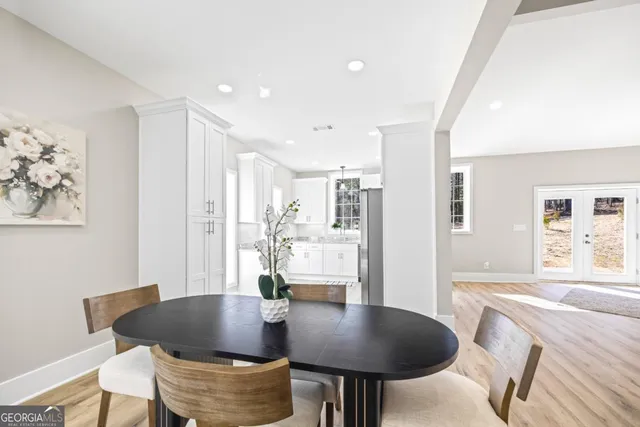 an empty room with a window and a ceiling fan