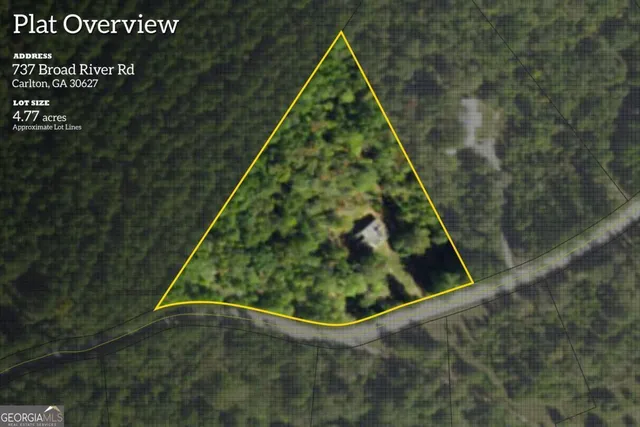 a white house with trees in front of it