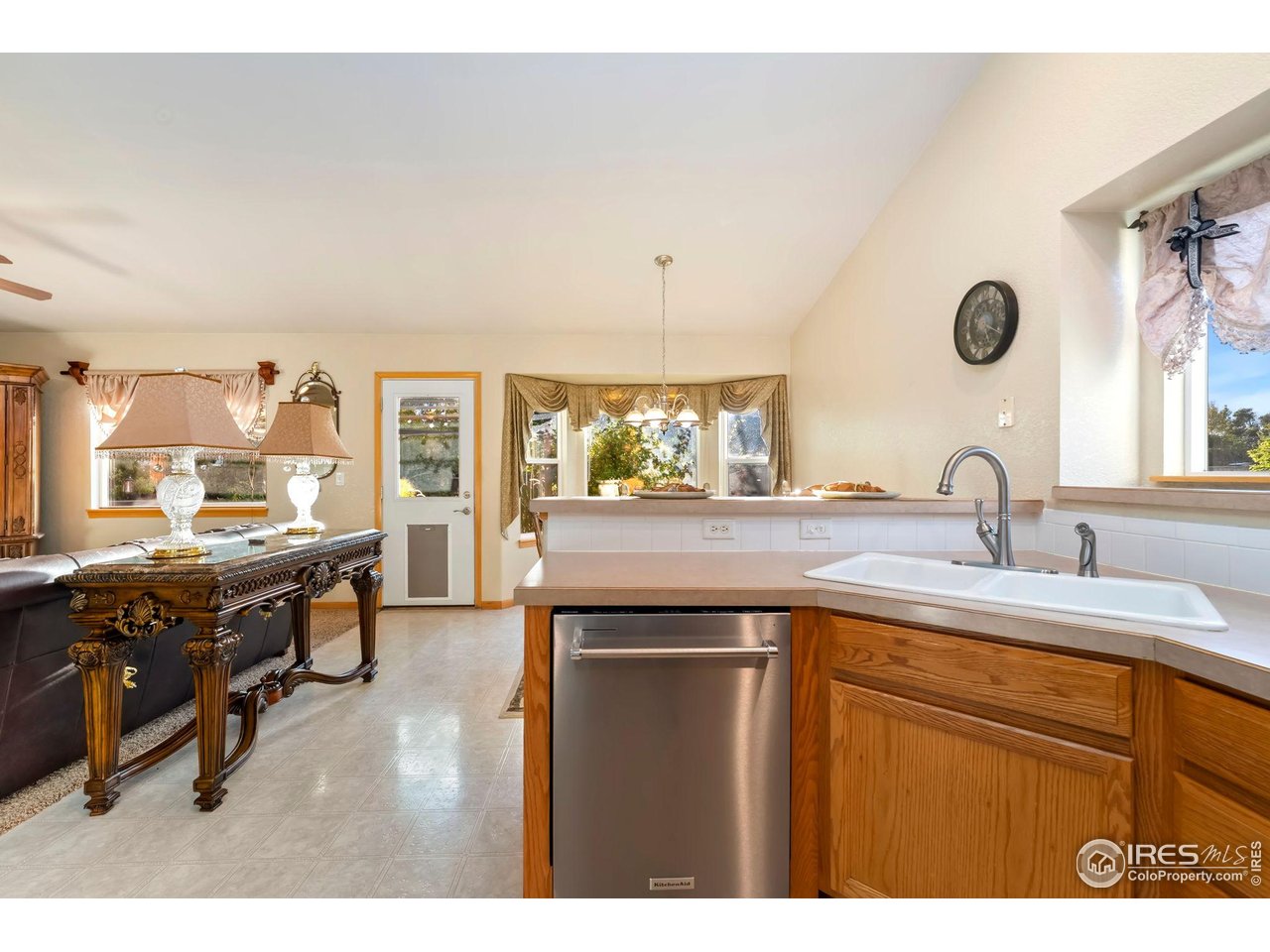 623 Foxtail Way Severance, CO 80550 - Photo 13 of 27 a kitchen with a sink and cabinets