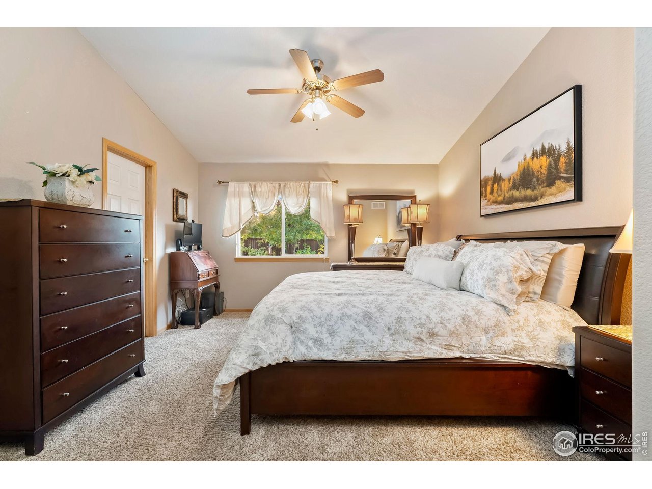 623 Foxtail Way Severance, CO 80550 - Photo 16 of 27 a spacious bedroom with a bed and window