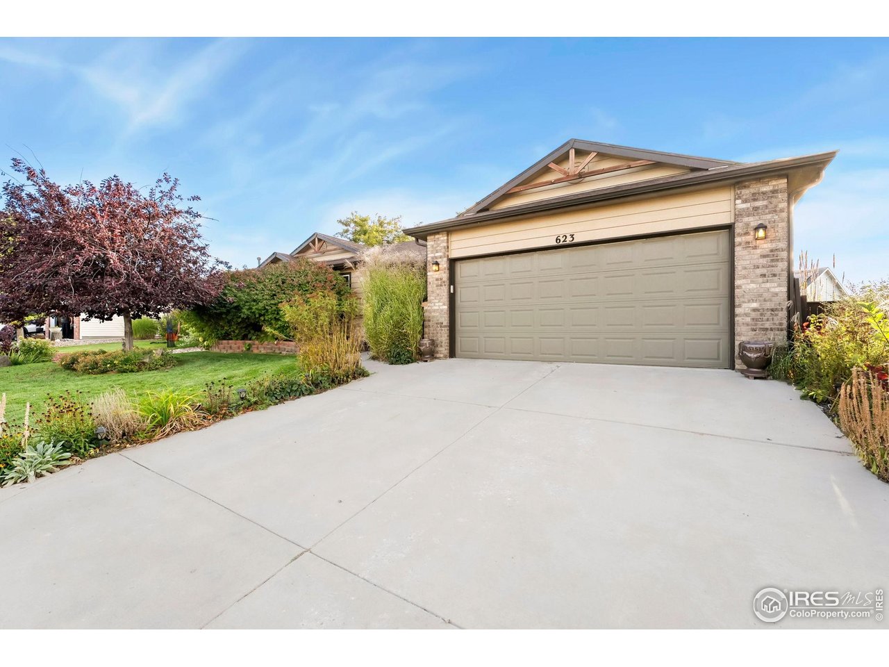 623 Foxtail Way Severance, CO 80550 - Photo 2 of 27 a front view of a house with a yard