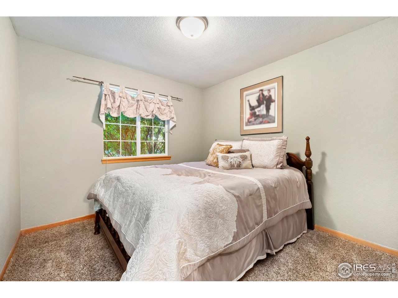623 Foxtail Way Severance, CO 80550 - Photo 22 of 27 a bedroom with a bed and a window