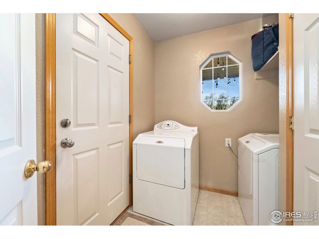 623 Foxtail Way Severance, CO 80550 - Photo 23 of 27 a utility room with dryer and washer