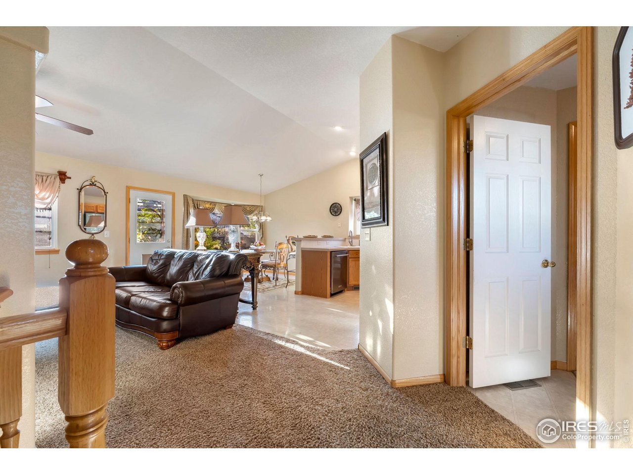 623 Foxtail Way Severance, CO 80550 - Photo 6 of 27 a living room with furniture and a flat screen tv