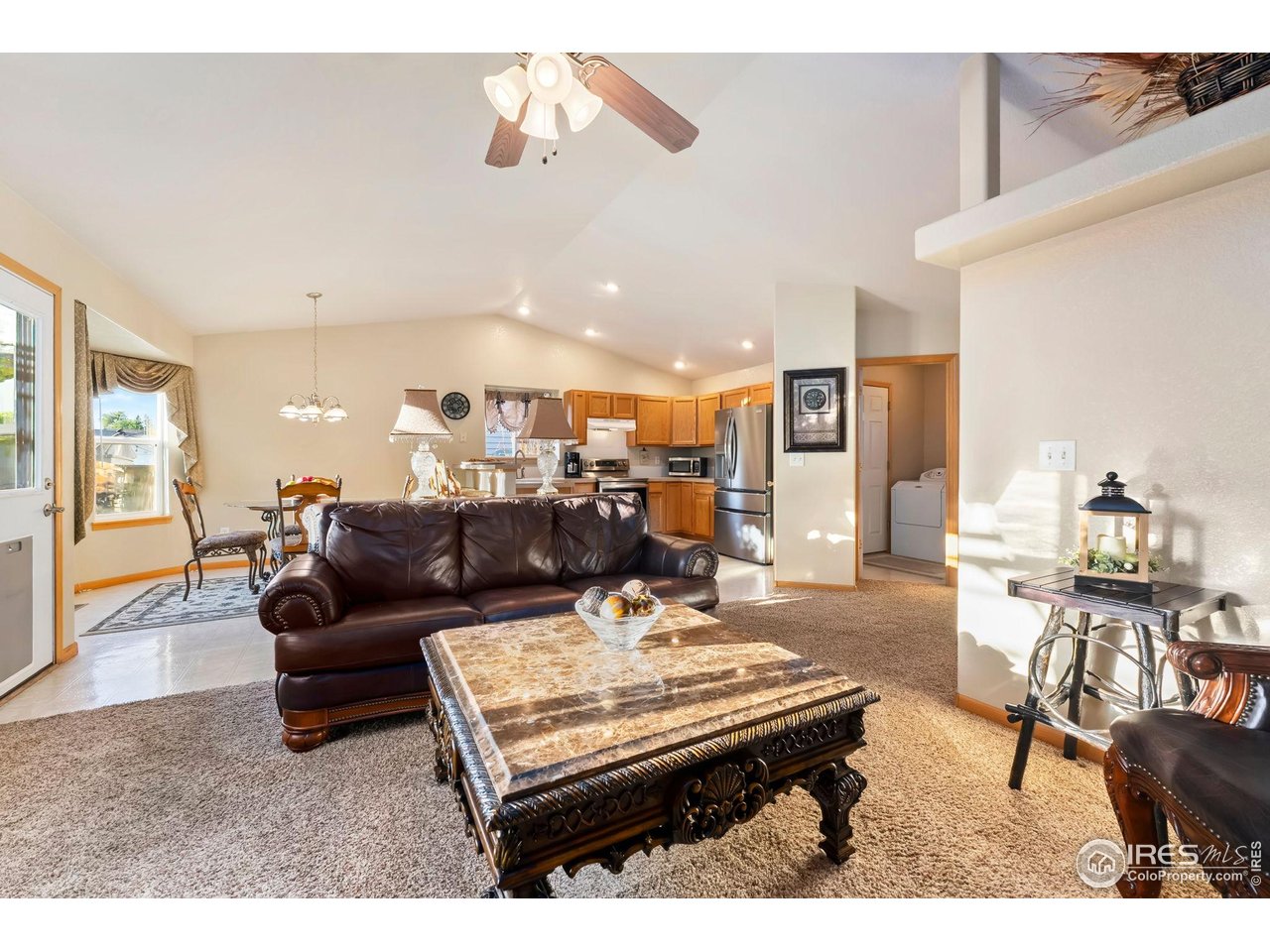 623 Foxtail Way Severance, CO 80550 - Photo 10 of 27 a living room with furniture and wooden floor
