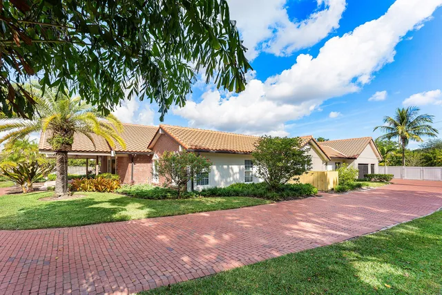 a living room with furniture and flat screen tv