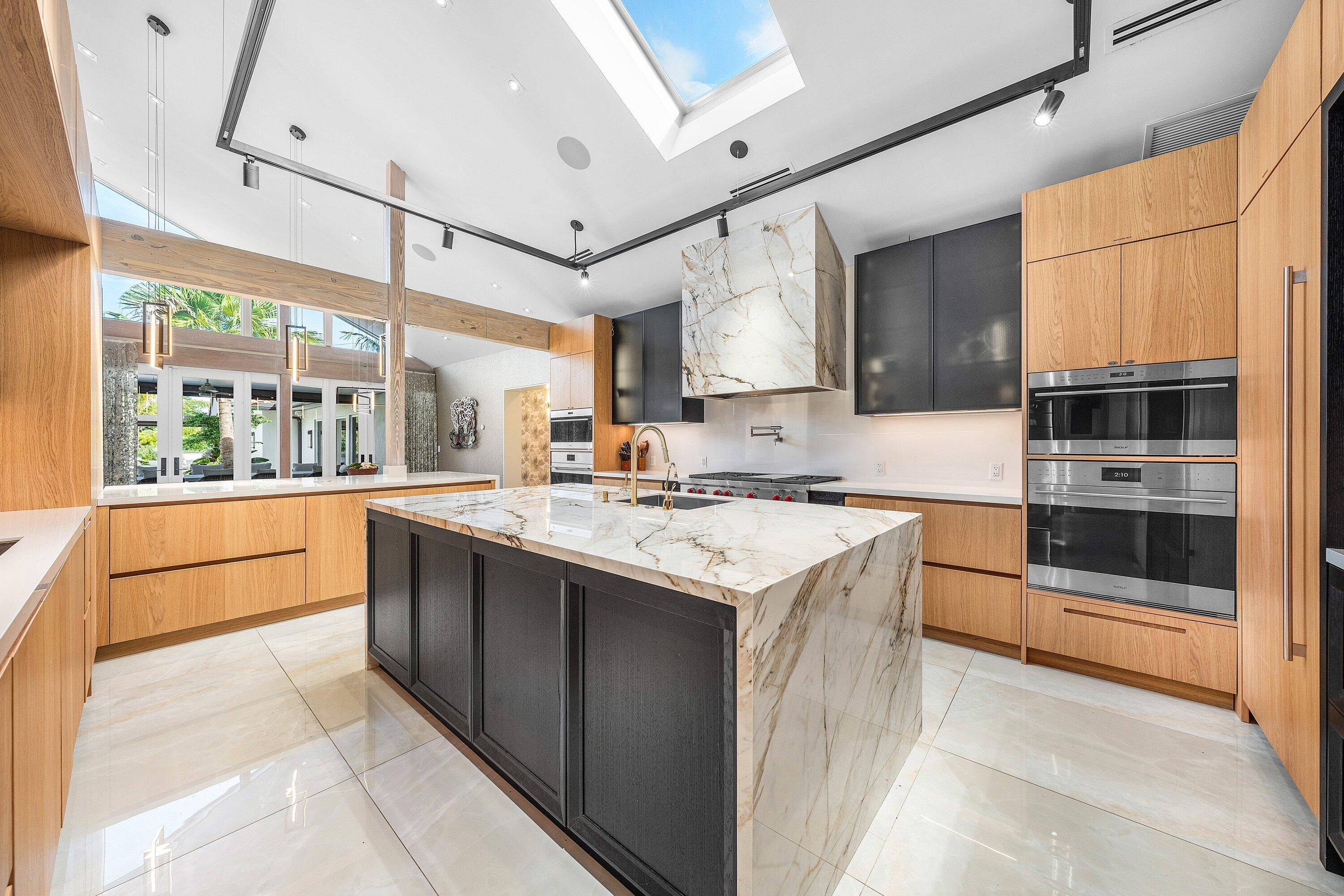 6641 Giralda Circle Boca Raton, FL 33433 - Photo 31 of 116 a kitchen with stainless steel appliances granite countertop a sink a stove and a refrigerator