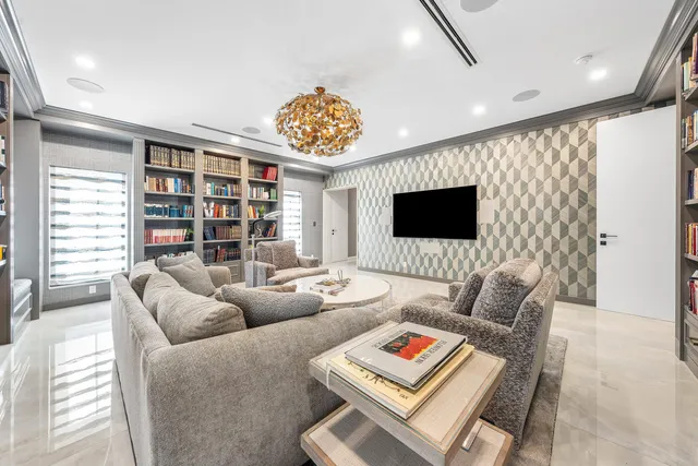 a dining room with furniture and a floor to ceiling window