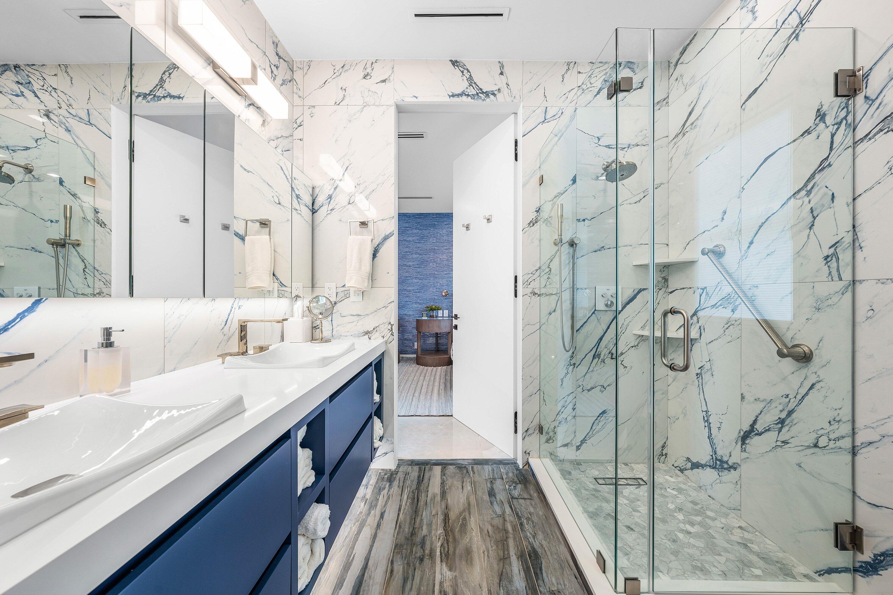 6641 Giralda Circle Boca Raton, FL 33433 - Photo 41 of 116 a spacious bathroom with a granite countertop double vanity sink a mirror and shower