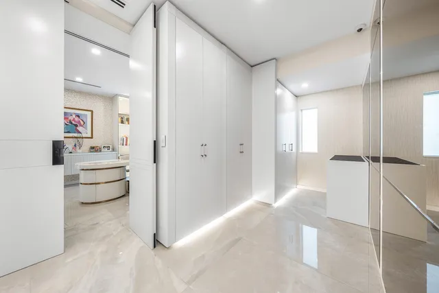 an aerial view of a house with a yard and swimming pool