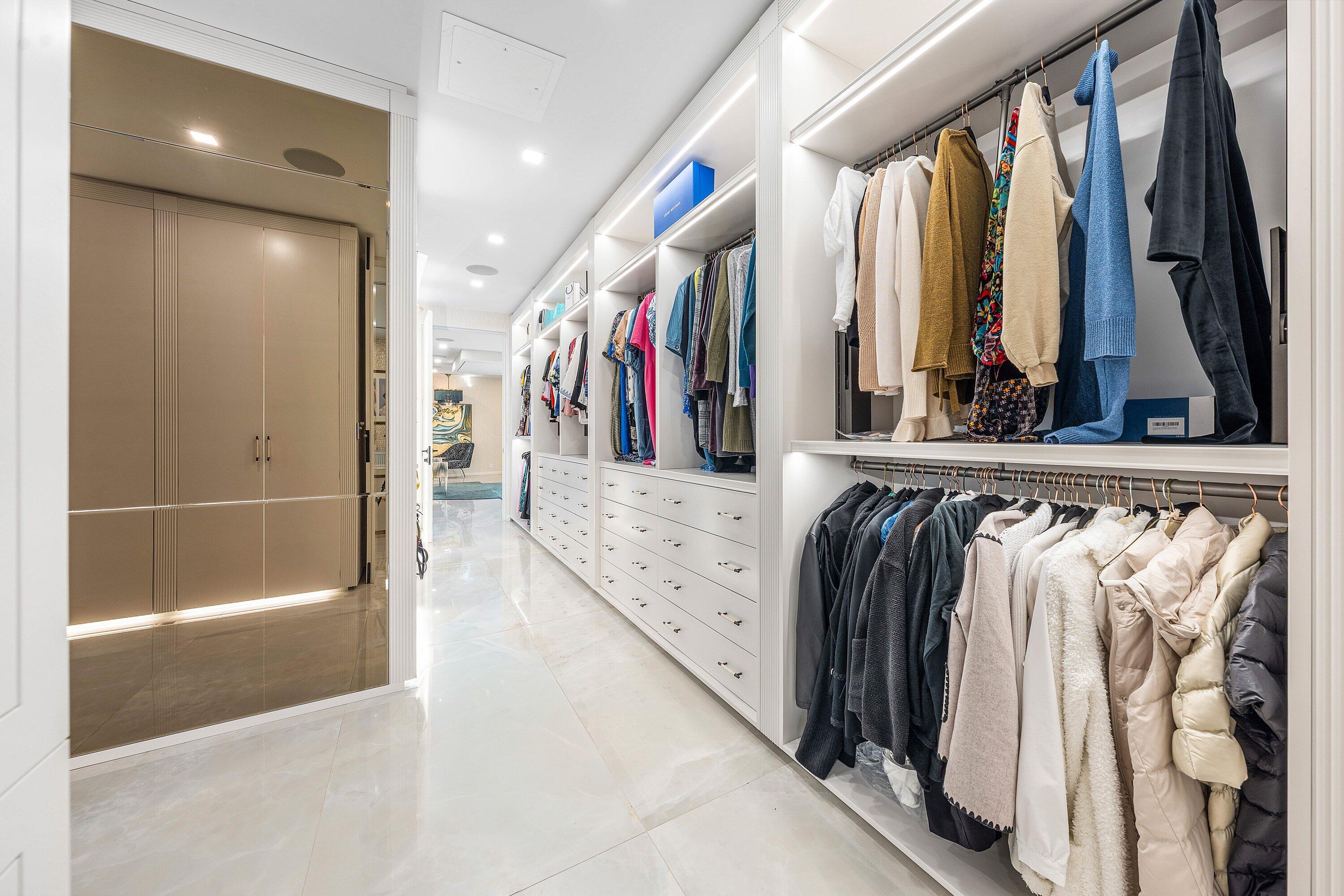 6641 Giralda Circle Boca Raton, FL 33433 - Photo 46 of 116 a view of walk in closet with clothes and shoes