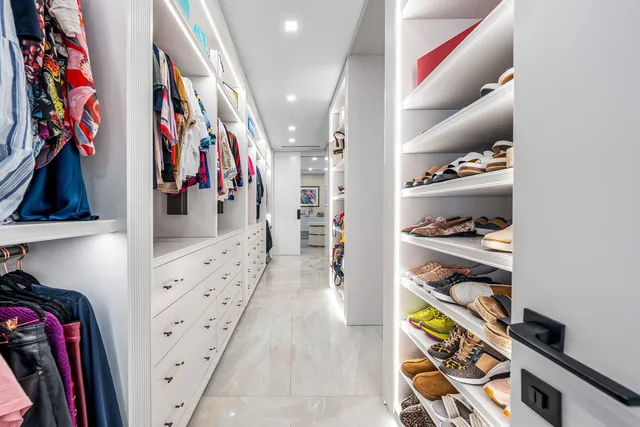 an aerial view of a house with a yard and garden