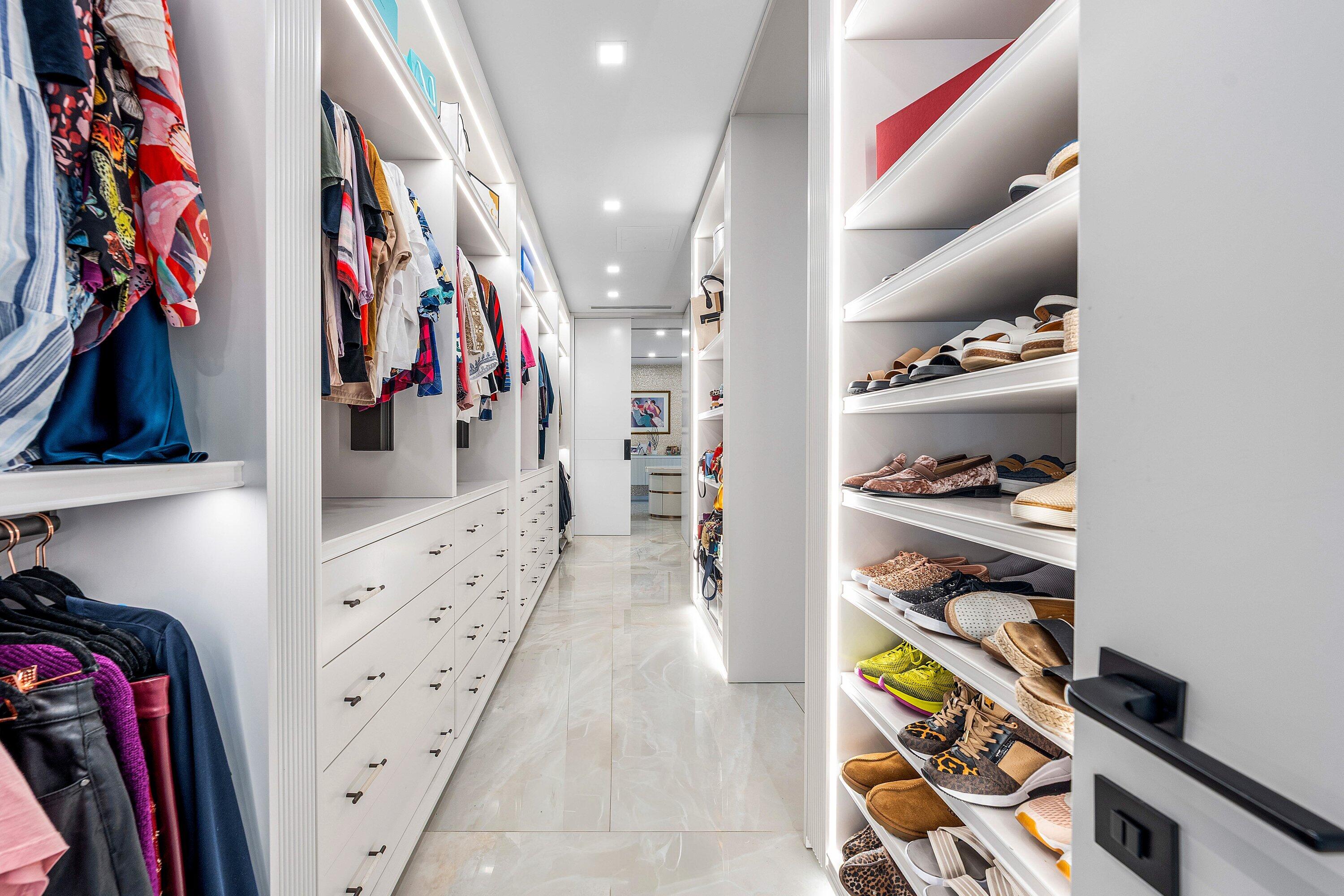 6641 Giralda Circle Boca Raton, FL 33433 - Photo 47 of 116 a view of walk in closet with clothes and shoes