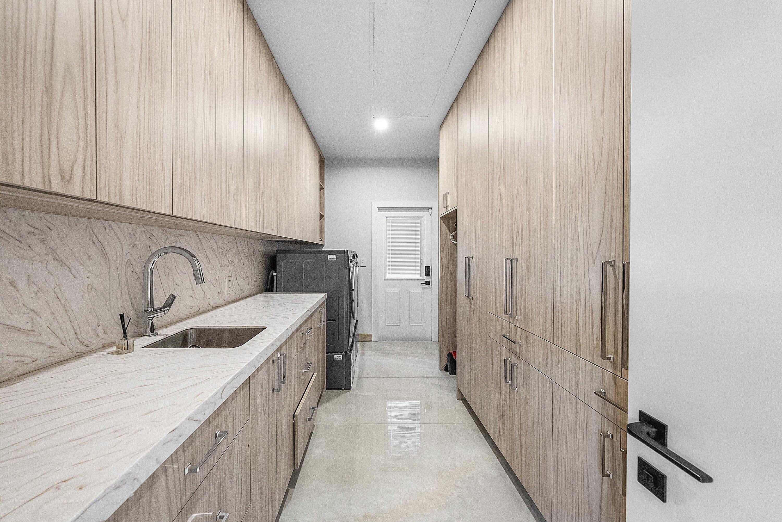 6641 Giralda Circle Boca Raton, FL 33433 - Photo 58 of 116 a kitchen with stainless steel appliances granite countertop a sink and a refrigerator