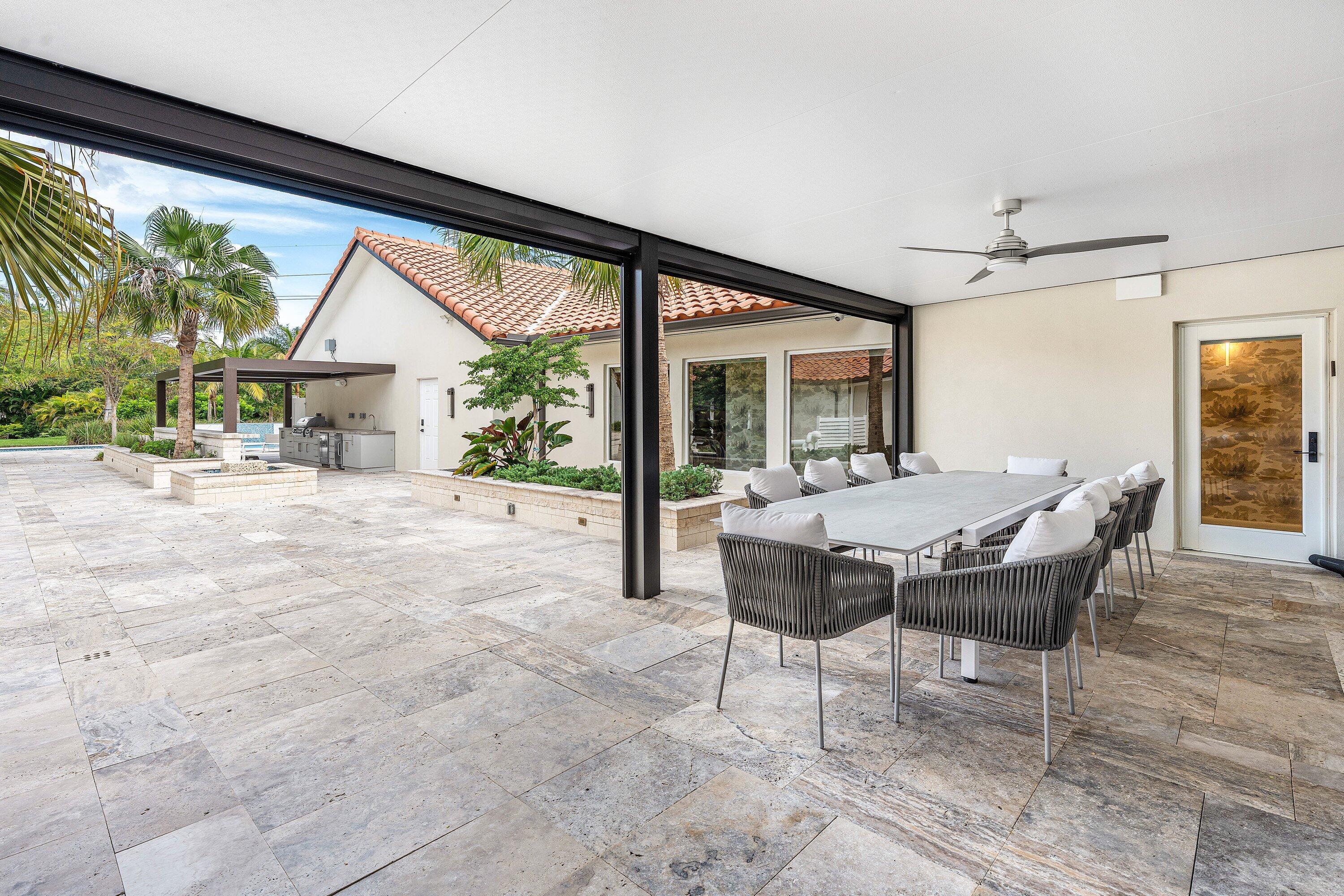 6641 Giralda Circle Boca Raton, FL 33433 - Photo 68 of 116 a dining room with furniture and a floor to ceiling window