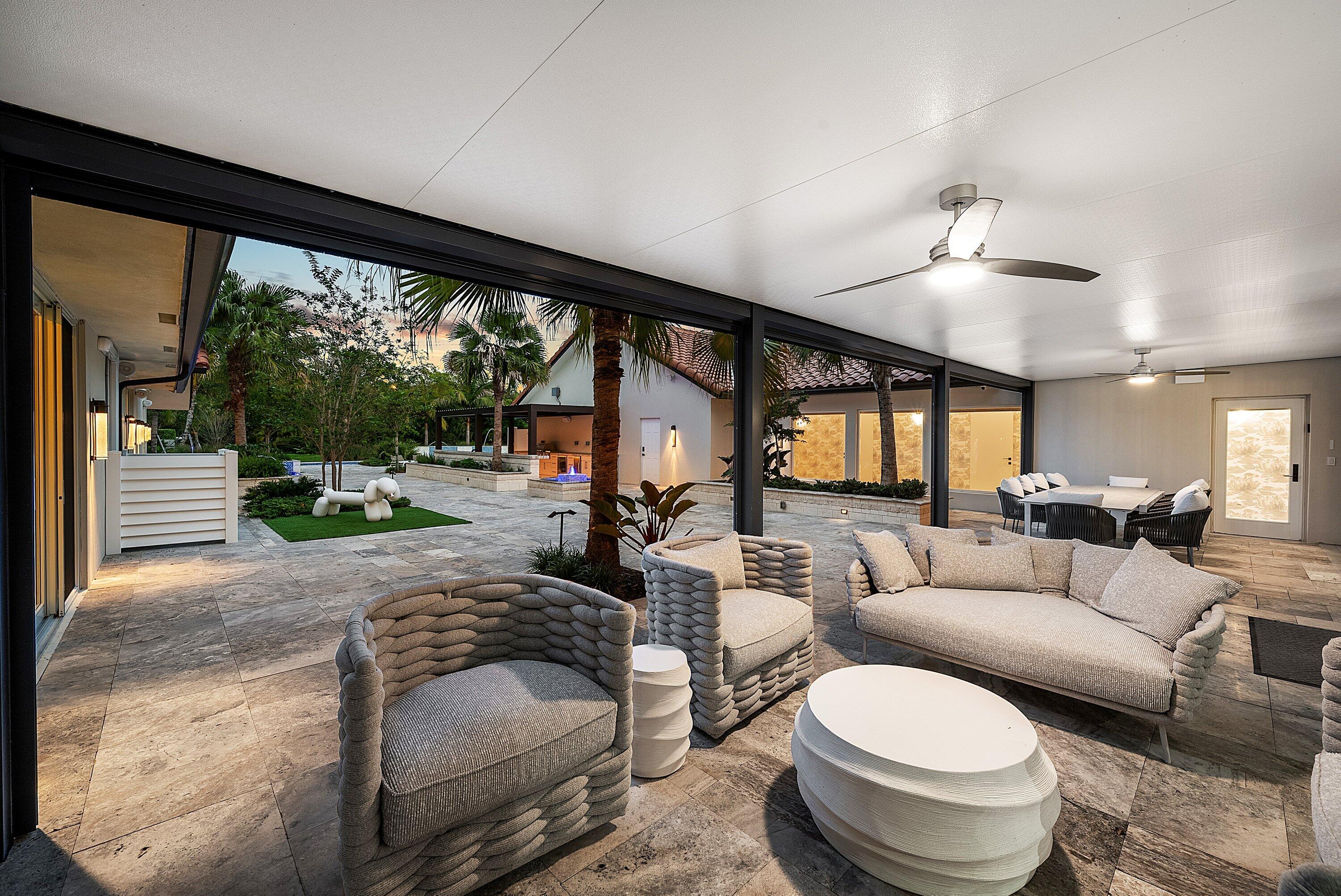 6641 Giralda Circle Boca Raton, FL 33433 - Photo 69 of 116 a living room with furniture and a large window