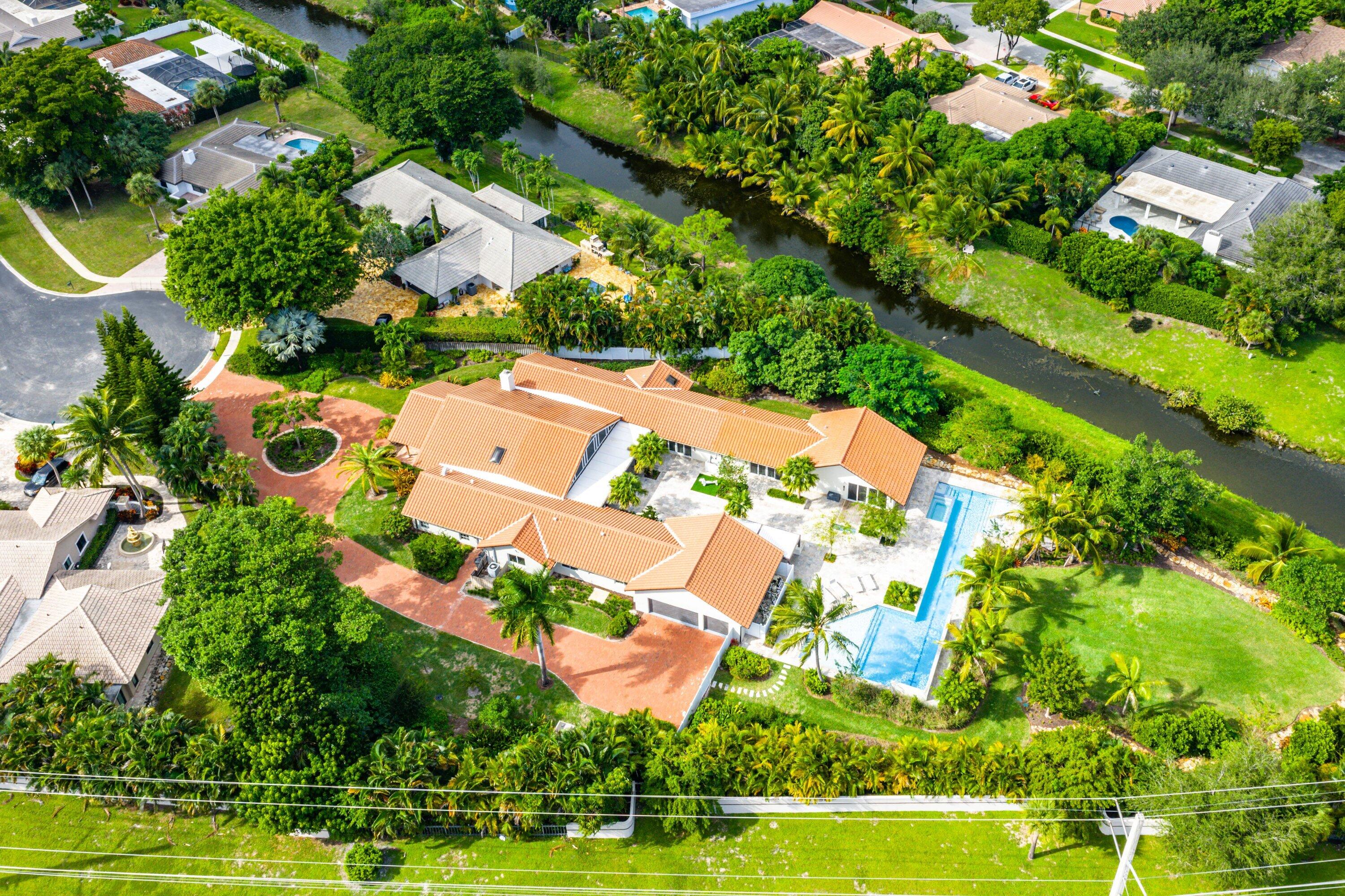 6641 Giralda Circle Boca Raton, FL 33433 - Photo 96 of 116 an aerial view of a house with a yard and swimming pool