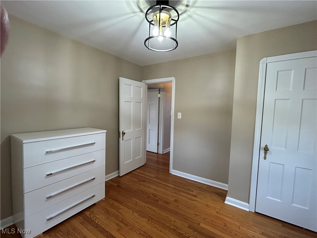 3589 Strandhill Road Beachwood, OH 44122 - Photo 15 of 23 Unfurnished bedroom with baseboards and dark wood-type flooring