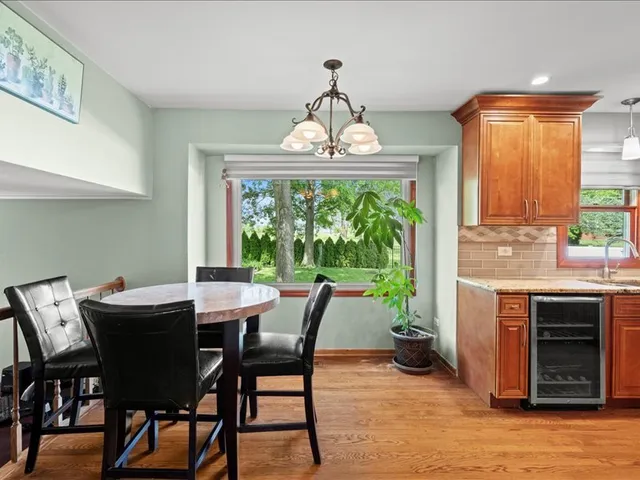 a view of a dining room with furniture window and outside view