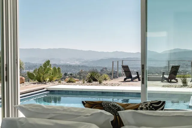 a view of swimming pool from a balcony