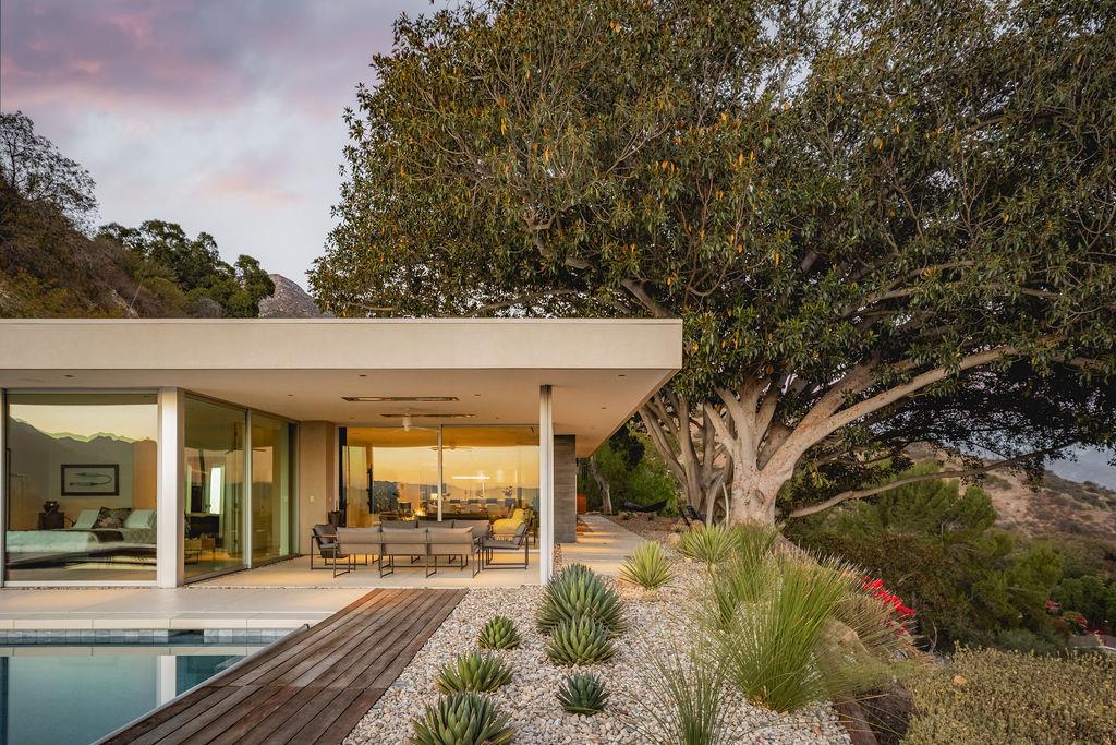 1465 Foothill Road Ojai, CA 93023 - Photo 2 of 33 a view of a patio with table and chairs and floor to ceiling window