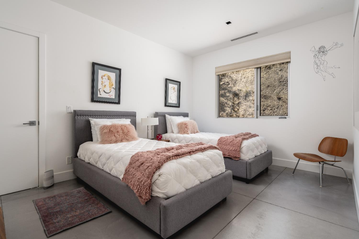 1465 Foothill Road Ojai, CA 93023 - Photo 23 of 33 a bedroom with bed and a chair