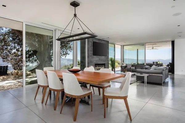 a view of a dining room with furniture window and outside view