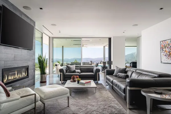 a living room with furniture fireplace and a flat screen tv